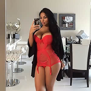 Dolly Castro poses and demonstrates her hot big breasts