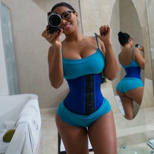 Foxy fox Dolly Castro poses and demonstrates her pretty boobs