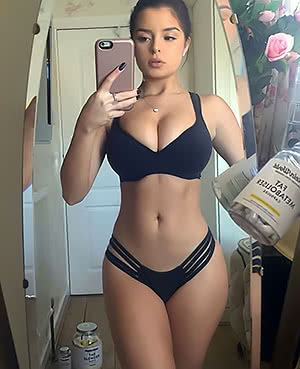 Lovely Demi Rose poses and demonstrates her tits
