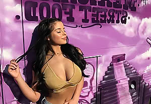 Spicy Demi Rose poses and demonstrates her tits
