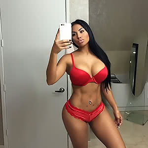 Seductive babe Dolly Castro teases with her amazing breasts